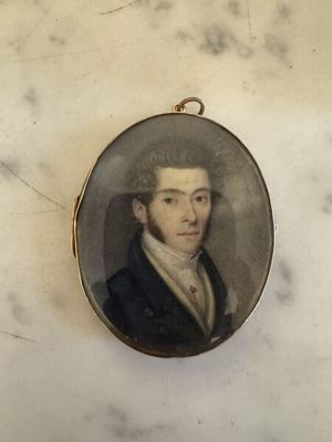 portrait of a man in a black suit and white shirt