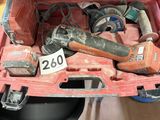 a red tool box with tools in it on the floor