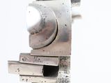 a close up of a piece of metal with a clock on it