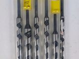 six pieces of drill bits in plastic bags on a white surface
