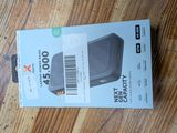 the box is open on a wooden floor with a barcode on it