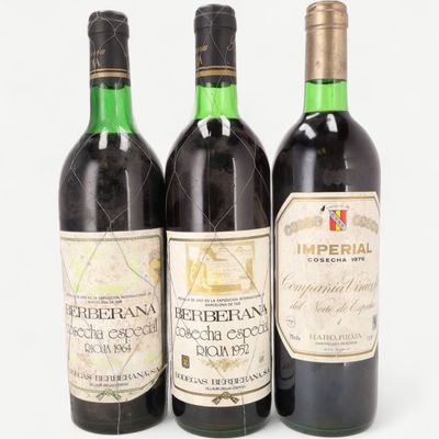 three bottles of wine sitting next to each other on a table