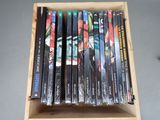 a lot of dvds in a wooden box on a table