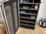 a metal case that is open on a hard wood floor