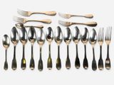 a lot of spoons and forks on the table