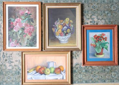 four paintings hanging on the wall of a room