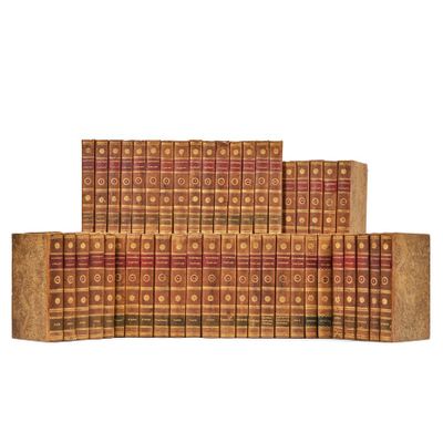 a stack of books sitting on top of each other on a white surface
