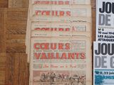 several newspapers on a wooden table with a bunch of different covers