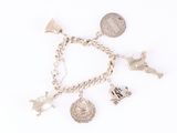 an image of a silver bracelet with charms on it