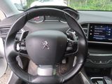 the interior of a car with a steering wheel and dashboard controls