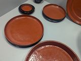many plates and bowls sitting on a white table