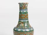 a vase that is sitting on a white surface