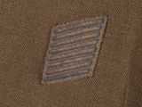 a close up of a brown jacket with a small patch on the back