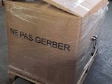 a large box on a pallet with a pair of scissors on it