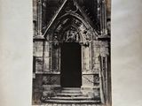 an old black and white photo of a doorway in a building