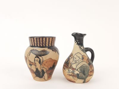two vases that are sitting side by side on a white surface