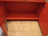 an image of a red cabinet in a room