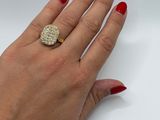 woman ' s hand with red manicured nails and a diamond ring