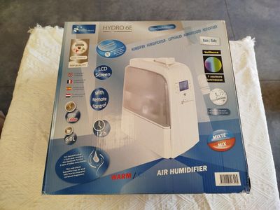 packaging of a humider sitting on top of a towel on top of a table