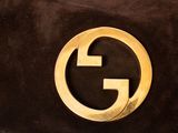 guccissi black sued clutch bag with gold g logo