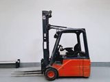 a forklift truck that is parked in a warehouse