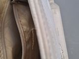 a white purse that is open on the table