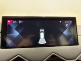a picture of a cell phone in the center of a car