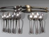 several spoons and spoon spoons are lined up on a table