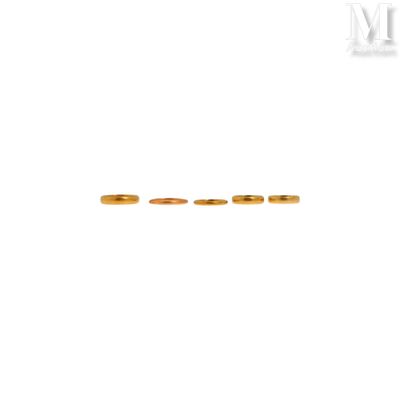 two gold wedding rings on a white background with a white background