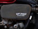 a close up of a motorcycle engine with the words vezzo custom written on it