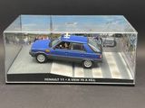 the blue car is in a clear box on the table