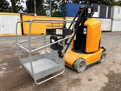 a forklift that is sitting in the dirt
