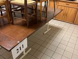 a table and chairs in a room with tile flooring