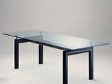 a glass table with black legs and a glass top