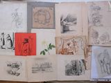 a lot of drawings on a piece of paper on a table