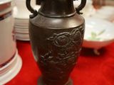 a vase that is sitting on a red table