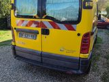 a yellow van that is parked on the side of the road