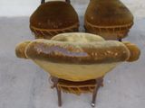 three chairs with a hot dog on top of them