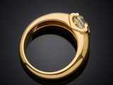 a yellow gold ring with a heart shaped diamond