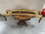a wooden table with a musical instrument on top of it