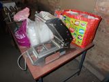 a table with a bunch of bags and bags on it