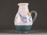 a blue and white vase with a bird painted on it