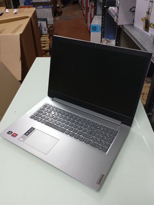 a laptop computer sitting on top of a table in a store