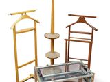 a glass table with a coat rack and a coat hanger on it