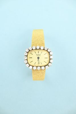an image of a woman ' s wrist watch with diamonds on a blue background