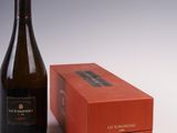 an image of a bottle of champagne next to a red box