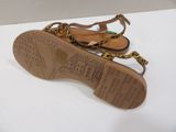 leopard print sandals on a white surface with a white background