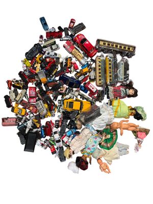 a pile of assorted toys on a white surface