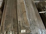 several pieces of wood are wrapped in plastic and stacked on top of each other