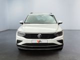 a white volkswagen t - cross parked in a white room
